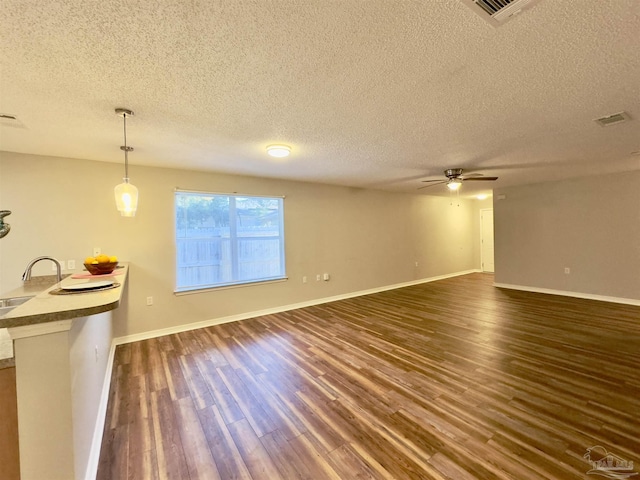 8037 Nalo Creek Loop, Pensacola, FL 32514 - living room with a ceiling fan, a textured ceiling, and dark wood finished floors