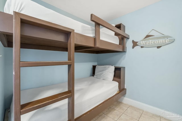 bedroom with light tile patterned floors