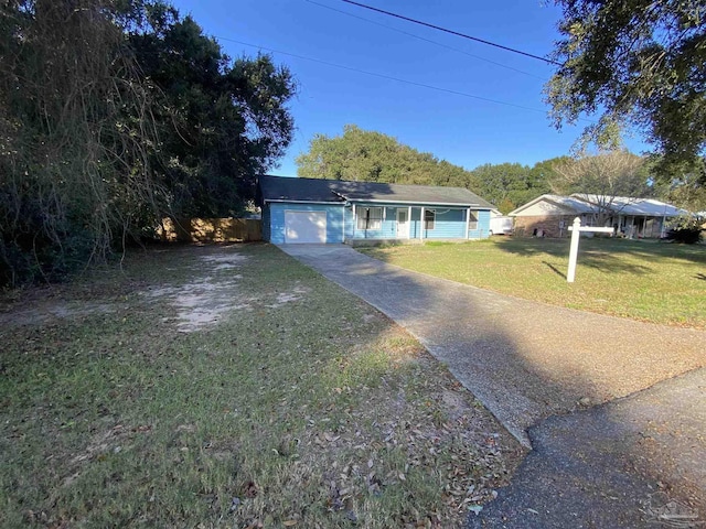 single story home featuring a front lawn and a garage