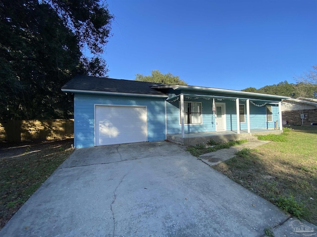 single story home with a front yard, a porch, and a garage