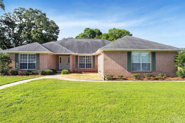 6299 Brandy Ln, Pensacola, FL 32526 - ranch-style house featuring brick siding, a front lawn, and a shingled roof