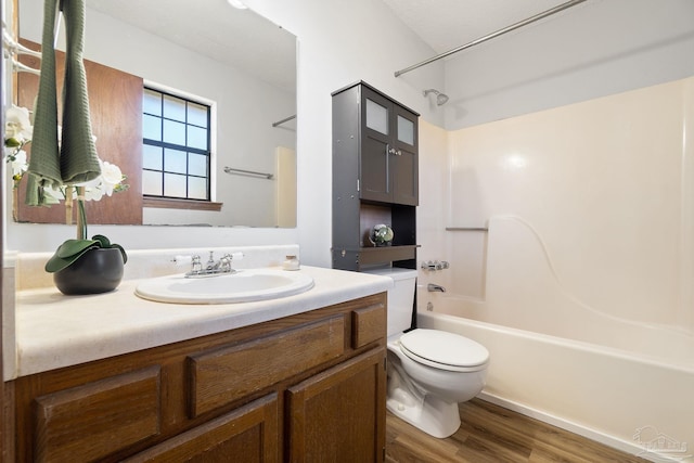 full bathroom featuring vanity, toilet, shower / bathing tub combination, and wood-type flooring