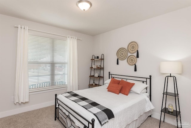 carpeted bedroom with multiple windows