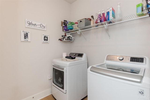 washroom with washer and clothes dryer