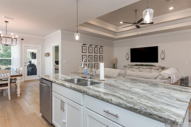 kitchen with white cabinets, pendant lighting, dishwasher, and sink