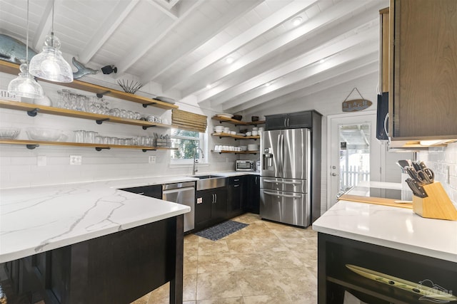 kitchen with sink, vaulted ceiling with beams, light stone countertops, appliances with stainless steel finishes, and tasteful backsplash