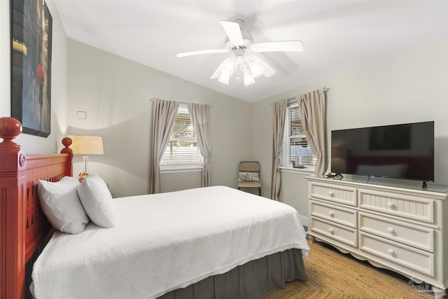 bedroom featuring ceiling fan and lofted ceiling