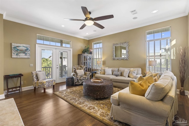 living room featuring a wealth of natural light, french doors, ceiling fan, and dark wood-type flooring