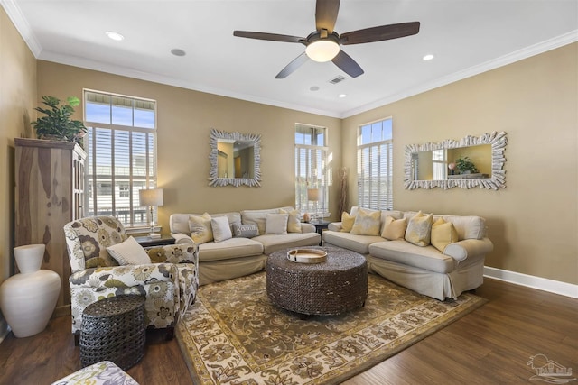 living room featuring dark hardwood / wood-style floors, ceiling fan, plenty of natural light, and ornamental molding