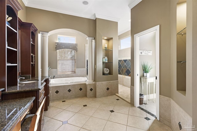 bathroom featuring tile patterned floors, ornate columns, and crown molding