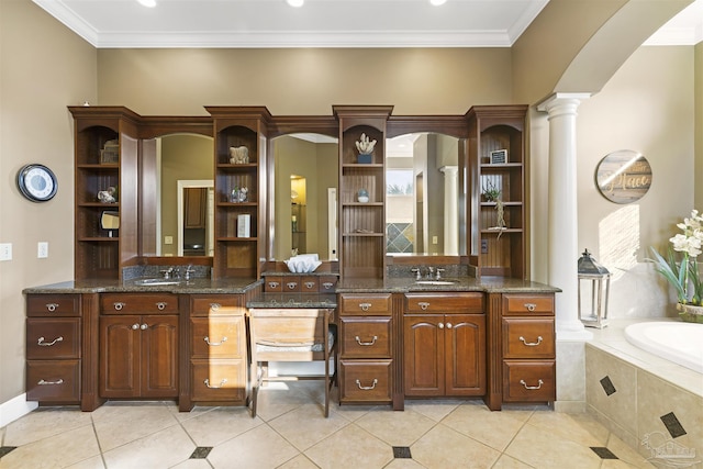 bathroom with ornate columns, tile patterned flooring, vanity, and ornamental molding