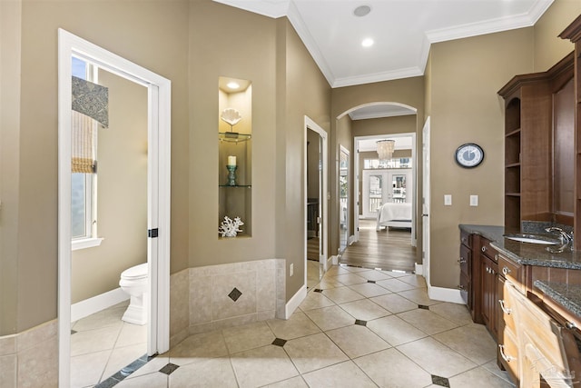 bathroom with vanity, french doors, tile patterned flooring, toilet, and ornamental molding