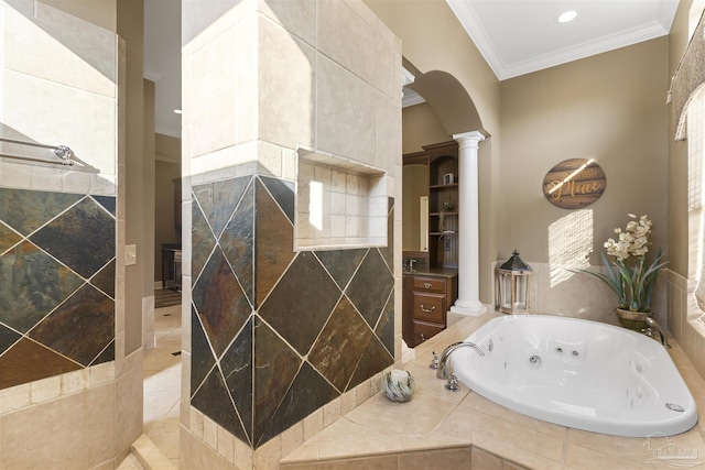 bathroom featuring ornate columns, crown molding, a relaxing tiled tub, and vanity