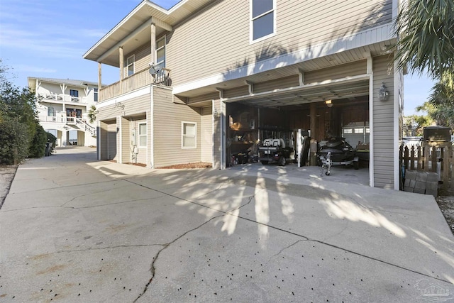 rear view of property featuring a balcony