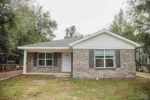 ranch-style home with a front yard