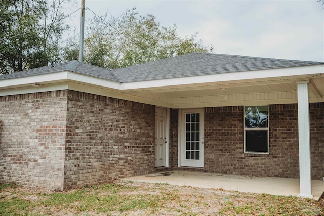 property entrance with a patio area