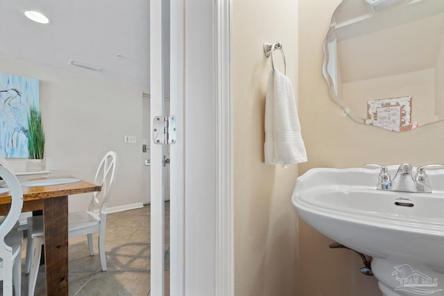 bathroom with tile patterned flooring and sink