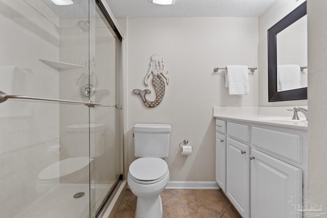 bathroom with tile patterned floors, vanity, toilet, and a shower with door