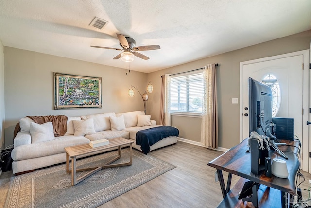 5518 Cyanamid Rd, Milton, FL 32583 - living room featuring wood finished floors, ceiling fan, and baseboards
