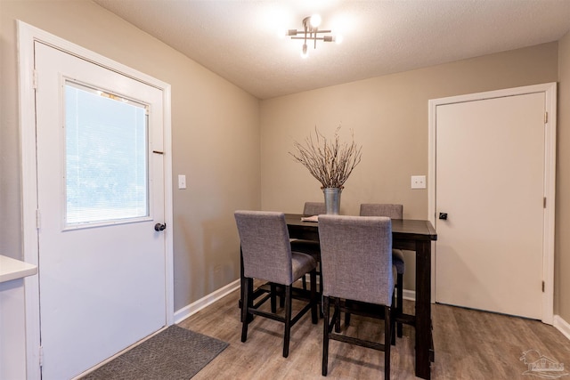 5518 Cyanamid Rd, Milton, FL 32583 - dining room featuring light wood-style floors and baseboards