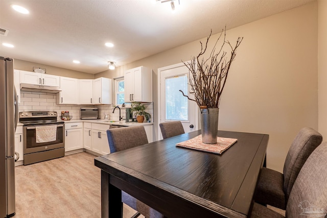 5518 Cyanamid Rd, Milton, FL 32583 - dining space with recessed lighting and light wood-style flooring