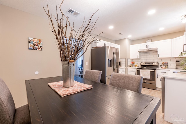 5518 Cyanamid Rd, Milton, FL 32583 - dining space featuring light wood-style floors and recessed lighting
