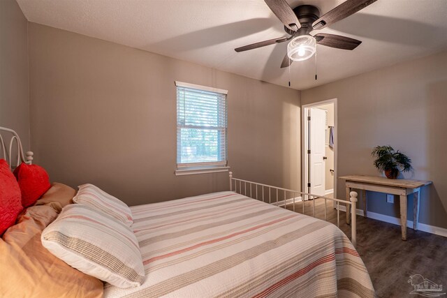 5518 Cyanamid Rd, Milton, FL 32583 - bedroom with wood finished floors, baseboards, and a ceiling fan