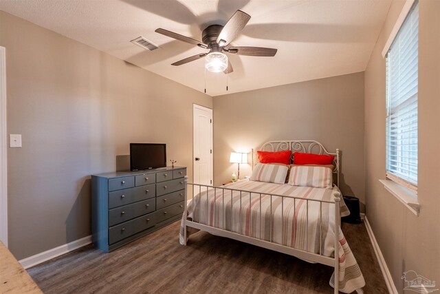 5518 Cyanamid Rd, Milton, FL 32583 - bedroom with wood finished floors, baseboards, and a ceiling fan
