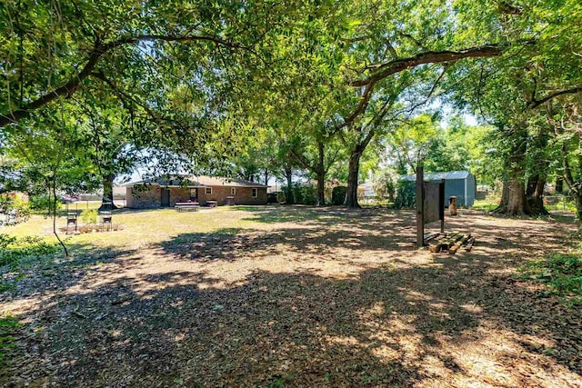 5518 Cyanamid Rd, Milton, FL 32583 - view of yard featuring a storage shed and an outdoor structure