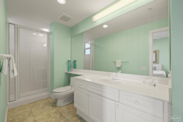 bathroom with tile patterned flooring, a textured ceiling, toilet, a shower with door, and vanity