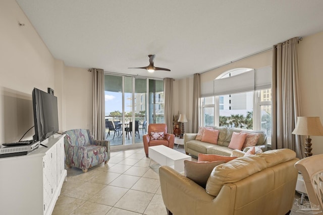 tiled living room featuring ceiling fan