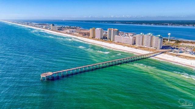 bird's eye view featuring a water view and a beach view