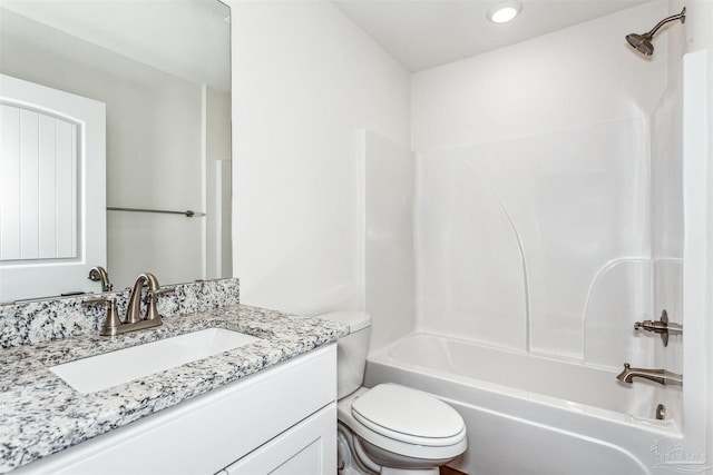 full bathroom with shower / bathing tub combination, vanity, and toilet