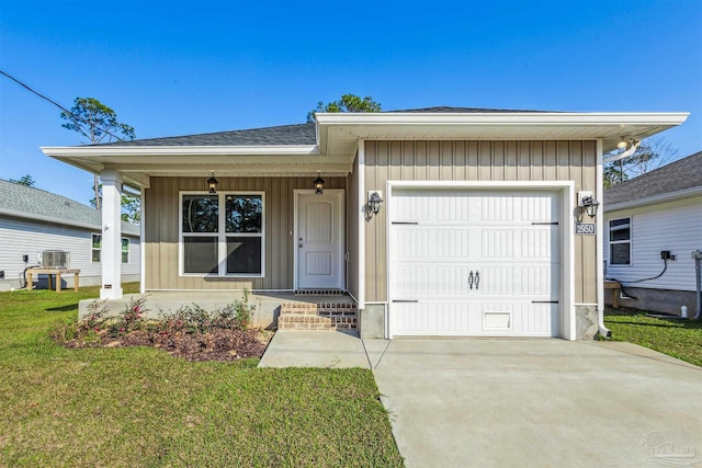 view of front of home featuring a garage, concrete driveway, covered porch, a front lawn, and board and batten siding