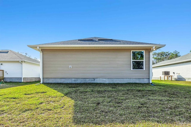 view of home's exterior with a lawn