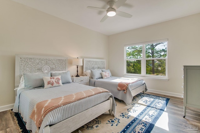 bedroom with wood-type flooring and ceiling fan