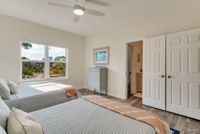 bedroom featuring ceiling fan and dark hardwood / wood-style flooring