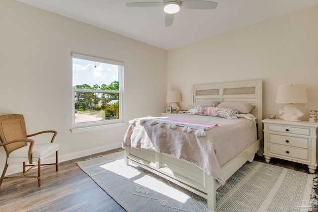 bedroom with ceiling fan and light hardwood / wood-style flooring