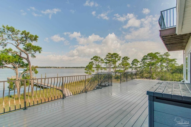 wooden deck featuring a water view