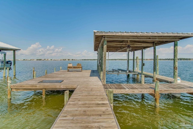 dock area with a water view