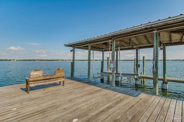 dock area with a water view