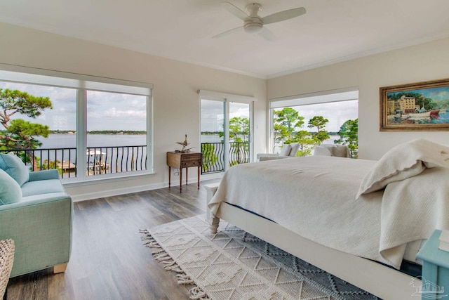 bedroom featuring crown molding, ceiling fan, hardwood / wood-style floors, a water view, and access to outside