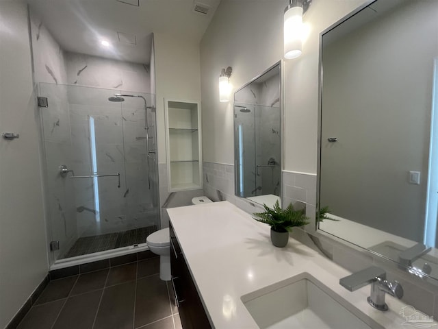 full bathroom with toilet, a stall shower, visible vents, and vanity