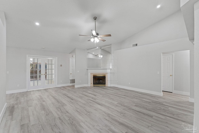 unfurnished living room featuring ceiling fan, high vaulted ceiling, and light hardwood / wood-style flooring