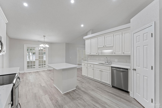 kitchen with a center island, white cabinetry, sink, and appliances with stainless steel finishes