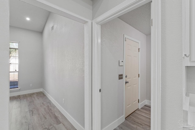 corridor featuring light hardwood / wood-style floors