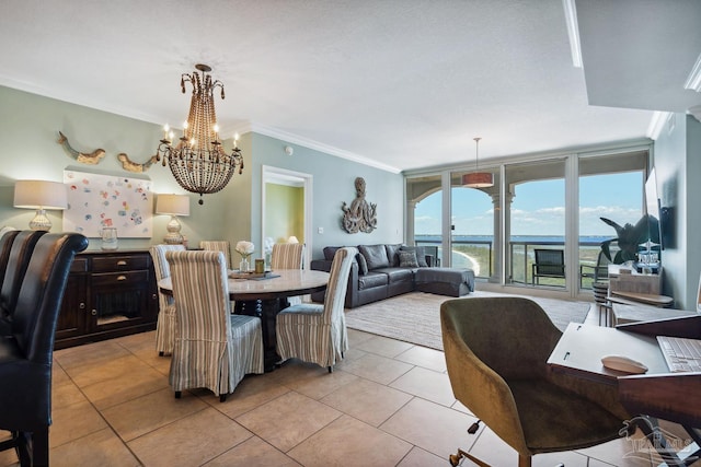 4 Portofino Dr Unit 803, Pensacola Beach, FL 32561 - dining space featuring ornamental molding, a chandelier, light tile patterned floors, and a water view