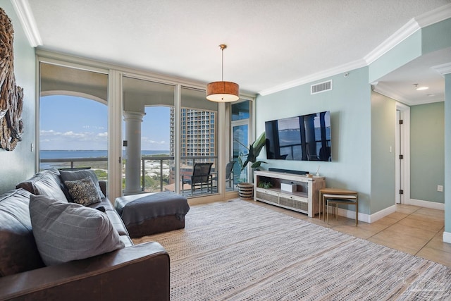 4 Portofino Dr Unit 803, Pensacola Beach, FL 32561 - tiled living area featuring crown molding and baseboards