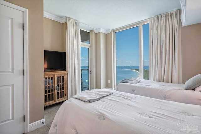 4 Portofino Dr Unit 803, Pensacola Beach, FL 32561 - tiled bedroom featuring access to exterior and crown molding