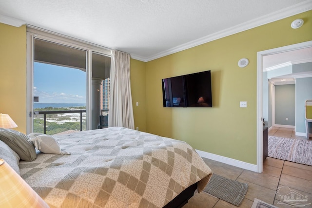 4 Portofino Dr Unit 803, Pensacola Beach, FL 32561 - bedroom with ornamental molding, tile patterned floors, access to exterior, and baseboards